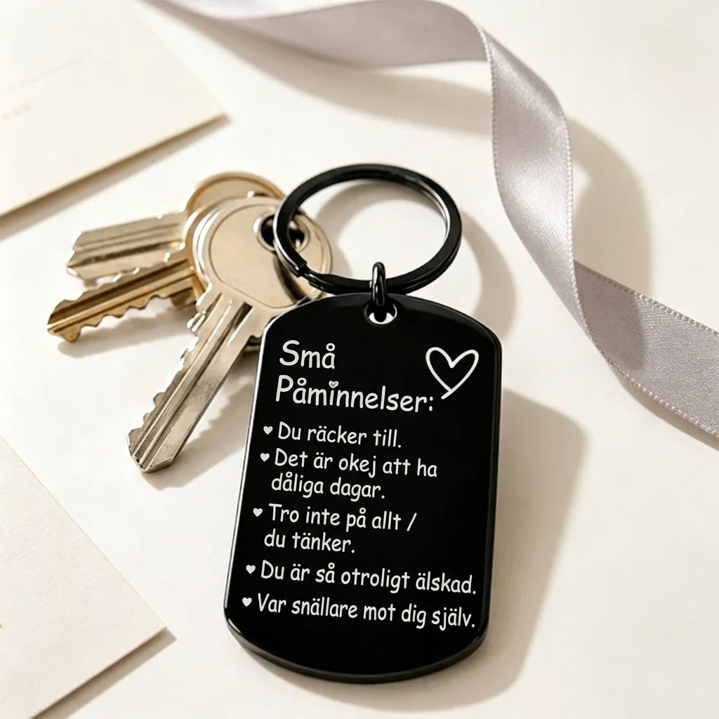 Inspirerande nyckelring med graverad text